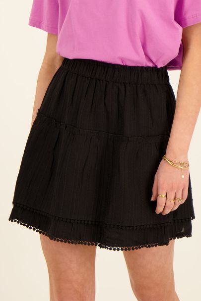 Black skirt with pompoms