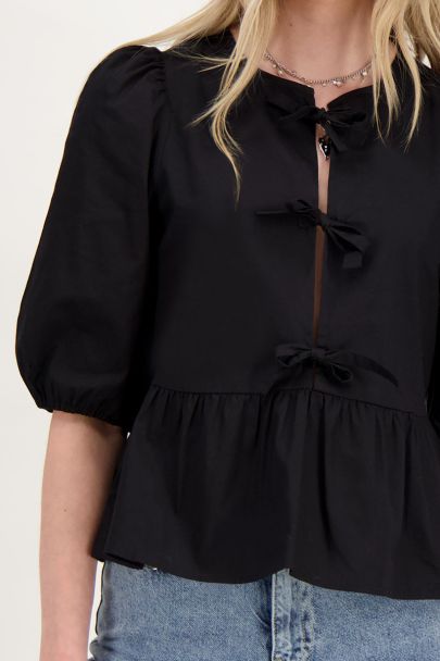 Black top with bows and puffed sleeves