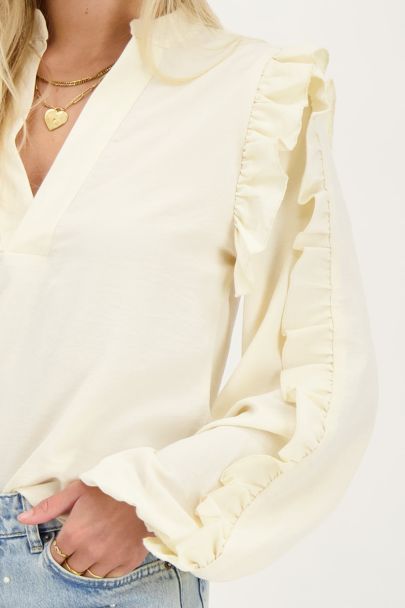Cream blouse with ruffled sleeves