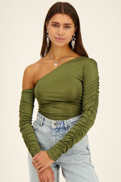 Green one-shoulder draped top with long sleeves