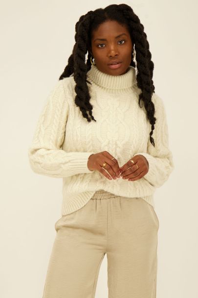 Beige cable knit turtleneck sweater