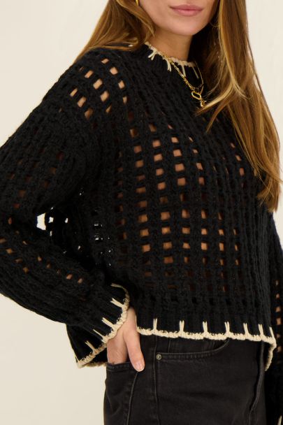 Black cable knit sweater with contrasting seam