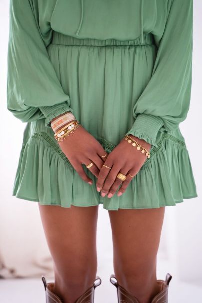 Mint green satin-look skirt with ruffles