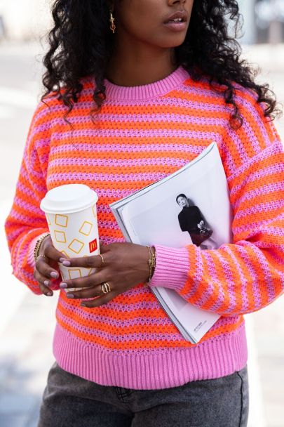 Pink sweater with textured stripes