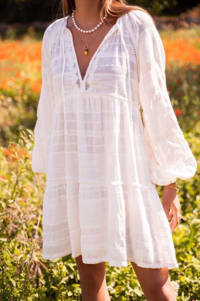 White dress with embroidered sleeves