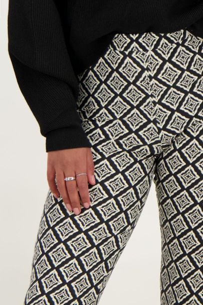 Black flared trousers with Ikat print