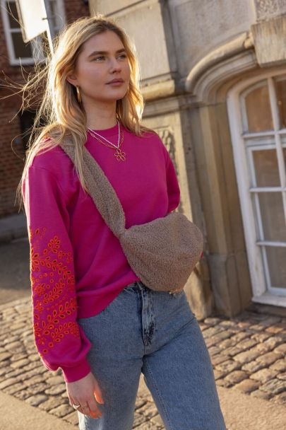 Pink sweater with embroidered sleeves