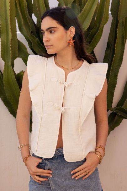 White gilet with ties and ruffles