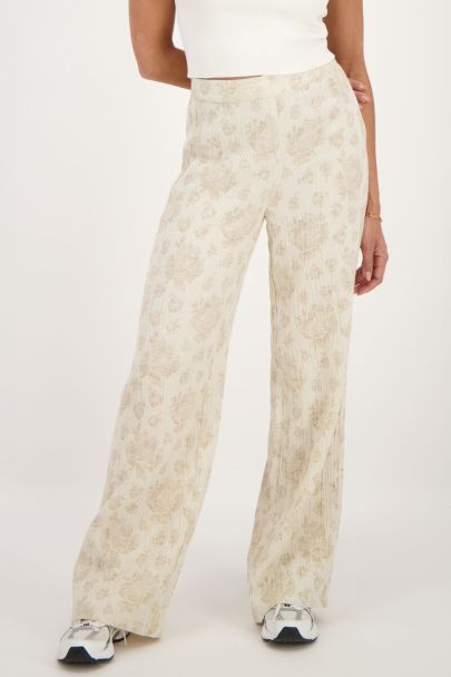 Beige trousers with jacquard flower print