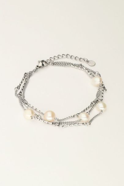 Bracelet with three necklaces and pearls