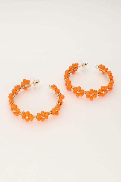 Large hoop earrings with orange flowers